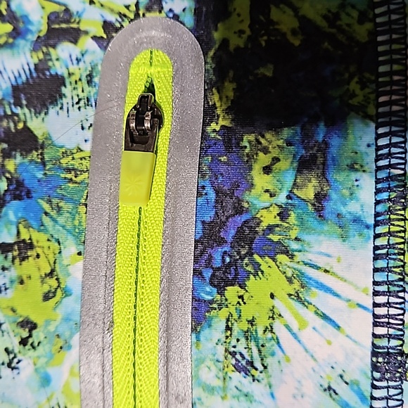 Athleta Athletic Shorts featuring vibrant colors w signature zipper on back. - Picture 4 of 8